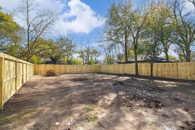 a view of backyard with green space