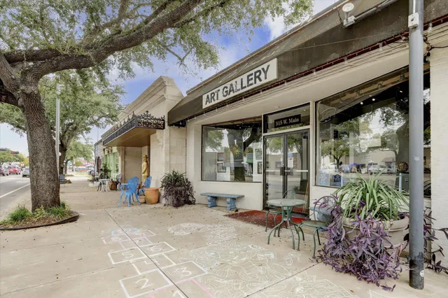 a view of a building with sitting area