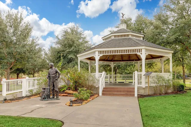 a view of a house with backyard porch and sitting area