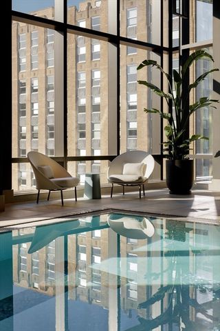 a view of a hall with cars parked