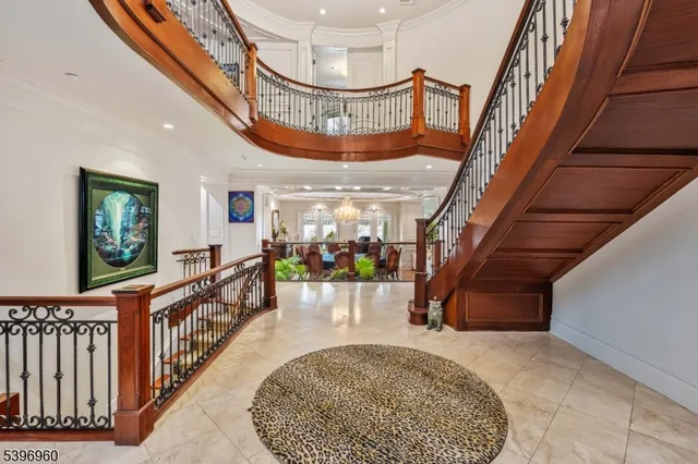 a dining room with furniture potted plants and wooden floor