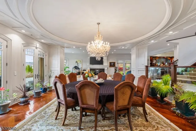 a living room with stainless steel appliances kitchen island granite countertop furniture a rug and a kitchen view