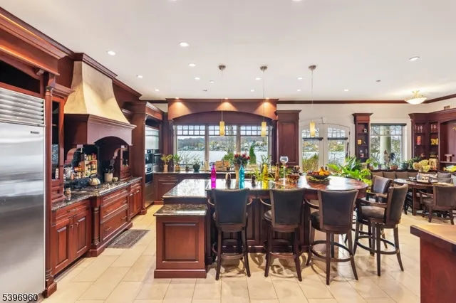 a bathroom with a granite countertop sink a toilet and a mirror