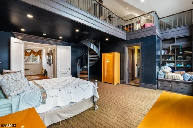 a spacious bedroom with a bed and a view of living room