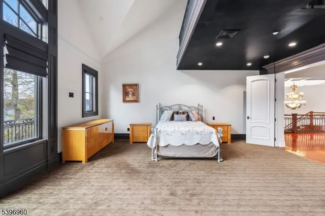 a open kitchen with a sink a stove a dining table and chairs