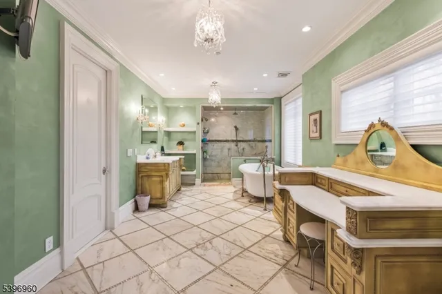 a living room with furniture a dining table and paintings on the wall