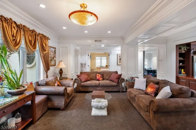 a spacious bedroom with a bed and a flat screen tv