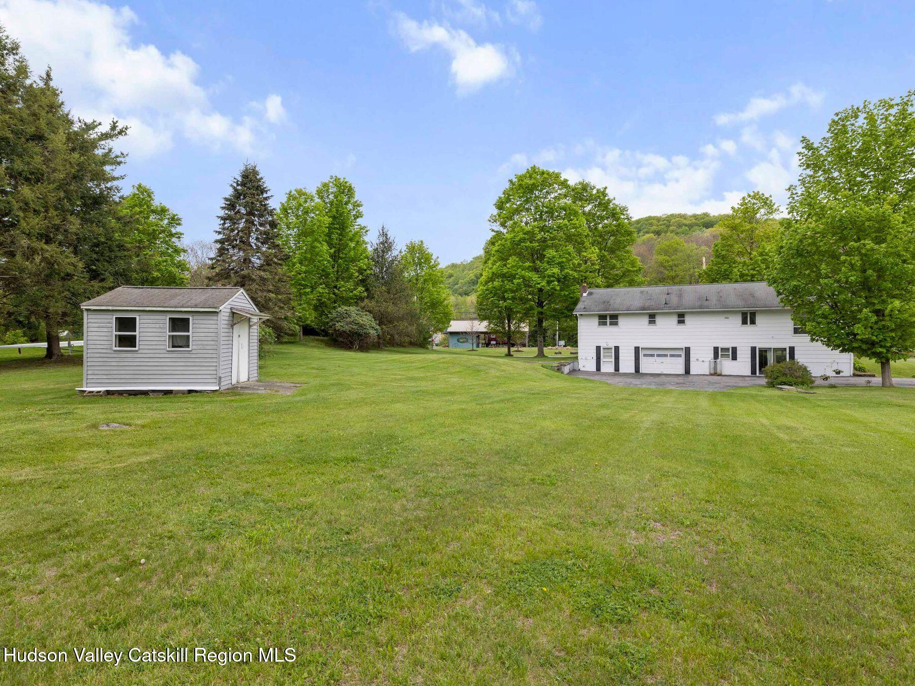 104 New Paltz Road Highland, NY 12528 - Photo 33 of 43 a view of a house with a yard and tree