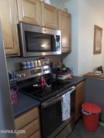 a kitchen with a stove and a microwave