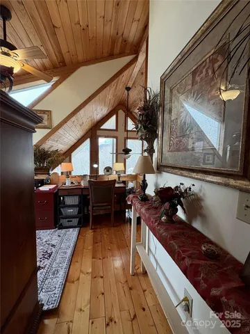 a kitchen with a stove and a wooden floor
