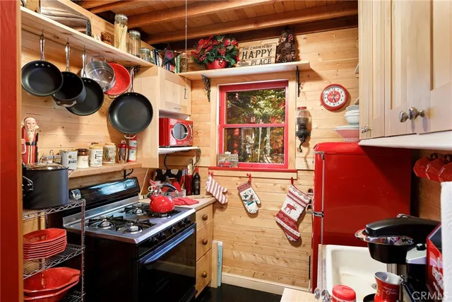 a kitchen with stainless steel appliances granite countertop a stove and a sink