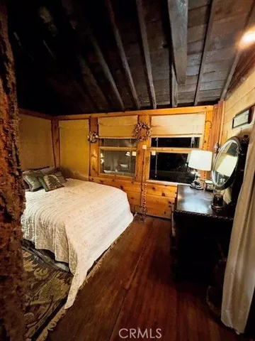 a bedroom with bed and a walk in closet