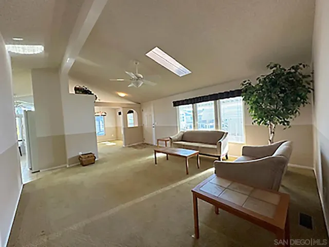 a lobby with furniture and window