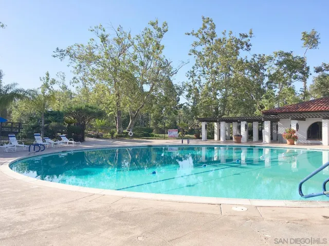 a view of a swimming pool with a patio
