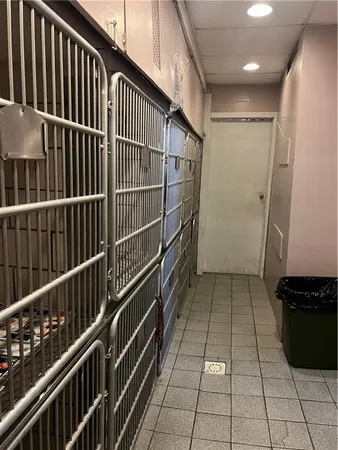 a view of a garage with wooden floor