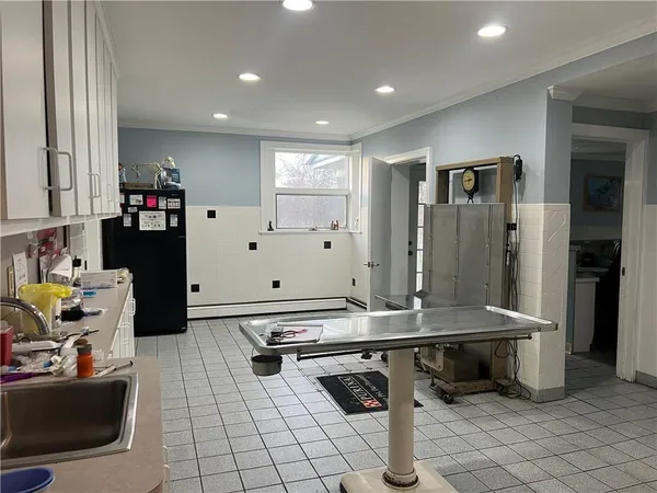 a kitchen with stainless steel appliances granite countertop a sink and cabinets