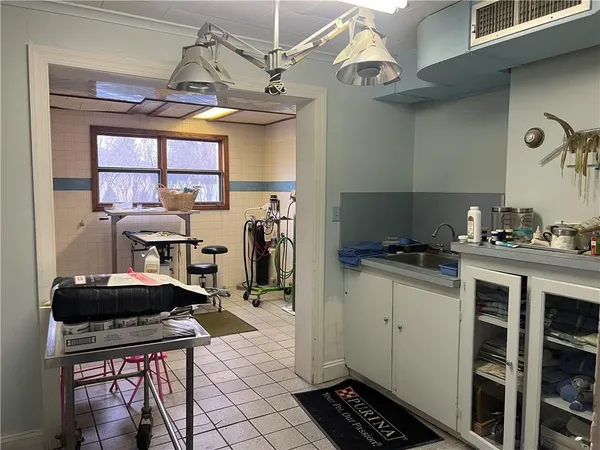 a kitchen with stainless steel appliances a stove a sink and a refrigerator