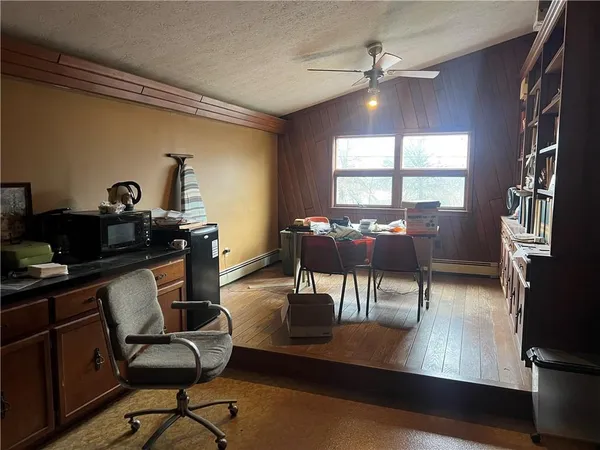 a workspace with furniture hardwood and a window