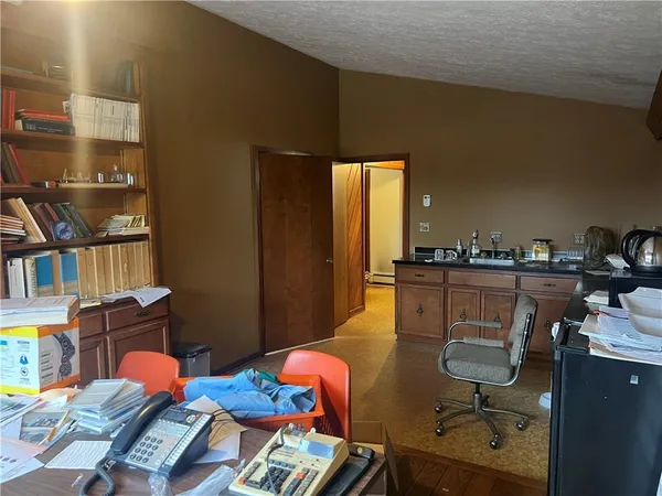 a view of a workspace with furniture