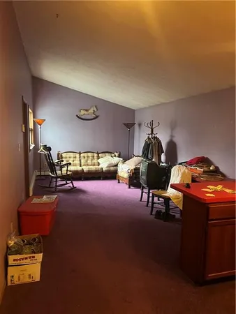 a room with furniture and air hockey table