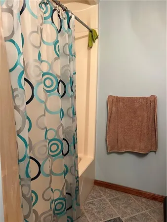 a blue and white door and a shower curtain