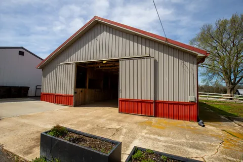 a view of an empty room with wooden walls