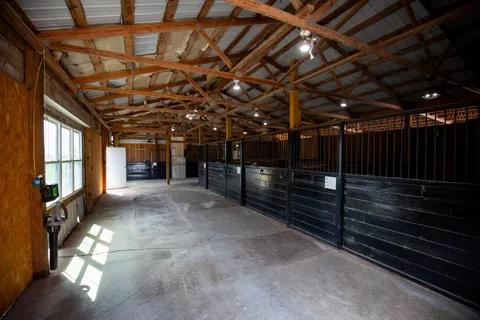 a view of park with wooden fence