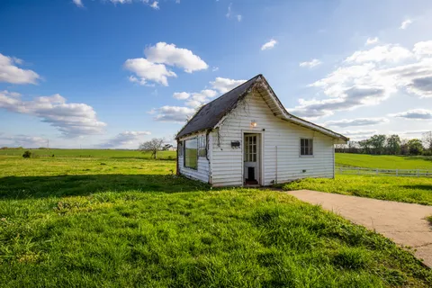 a view of a large building with big yard