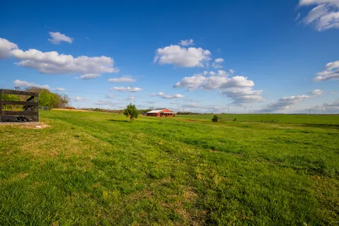 a view of swimming pool with a yard