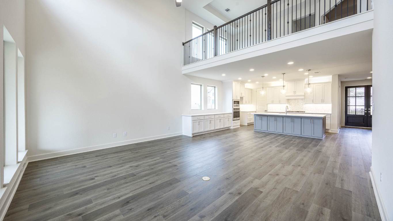 1517 Rodeo Ridge Drive Georgetown, TX 78628 - Photo 8 of 39 an empty room with wooden floor and windows