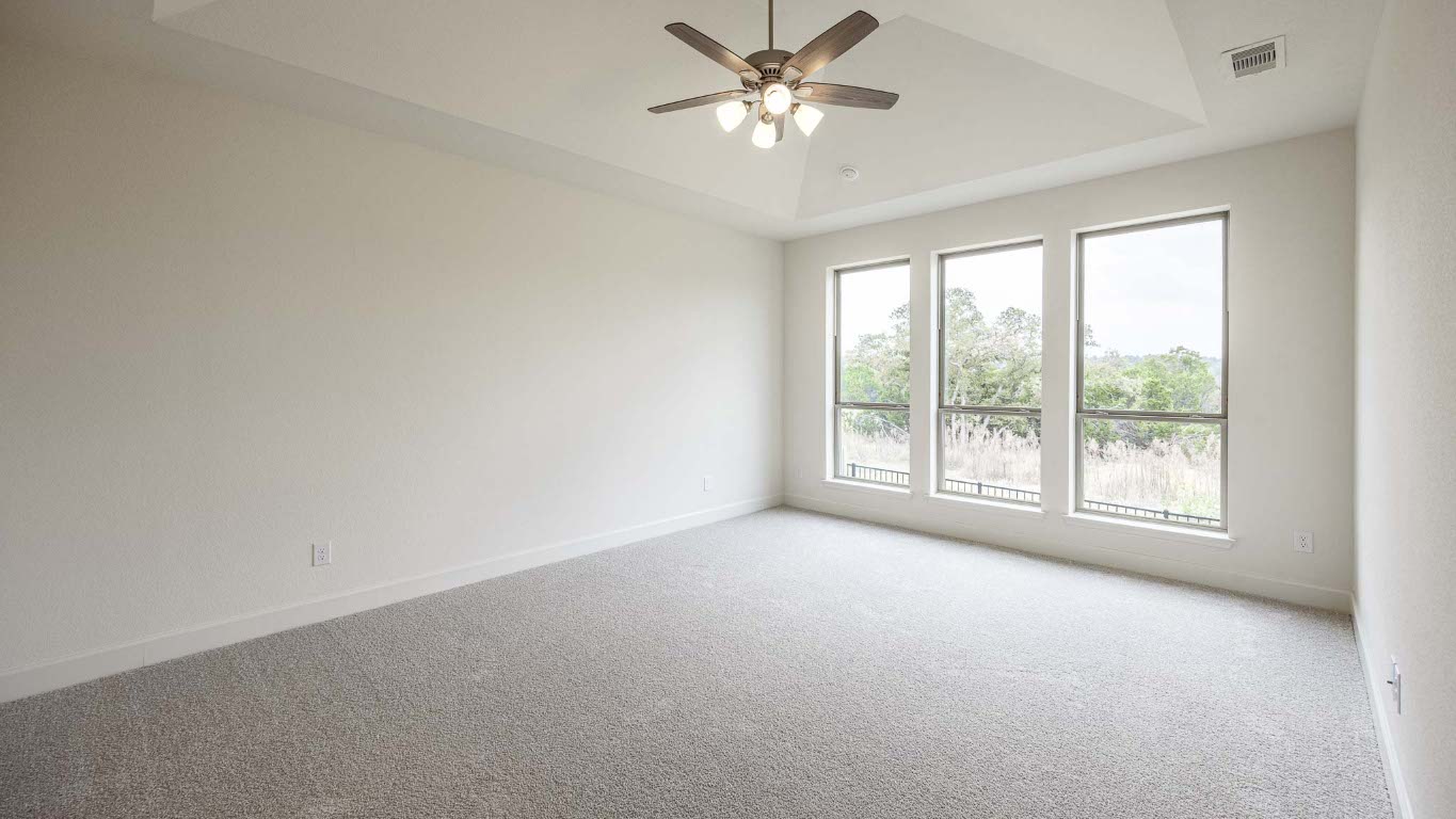 1517 Rodeo Ridge Drive Georgetown, TX 78628 - Photo 9 of 39 a view of a big room with windows and chandelier fan