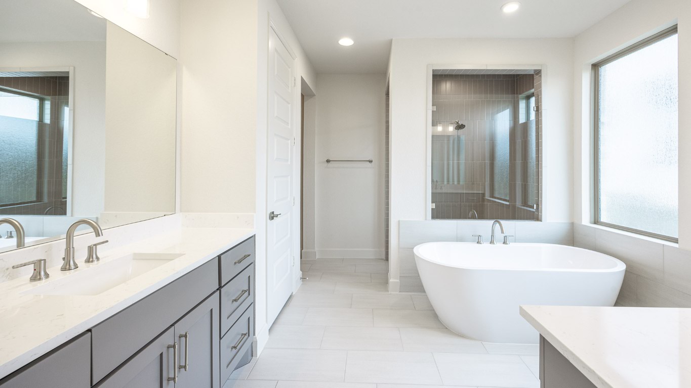 1517 Rodeo Ridge Drive Georgetown, TX 78628 - Photo 10 of 39 a spacious bathroom with a double vanity sink mirror and bathtub