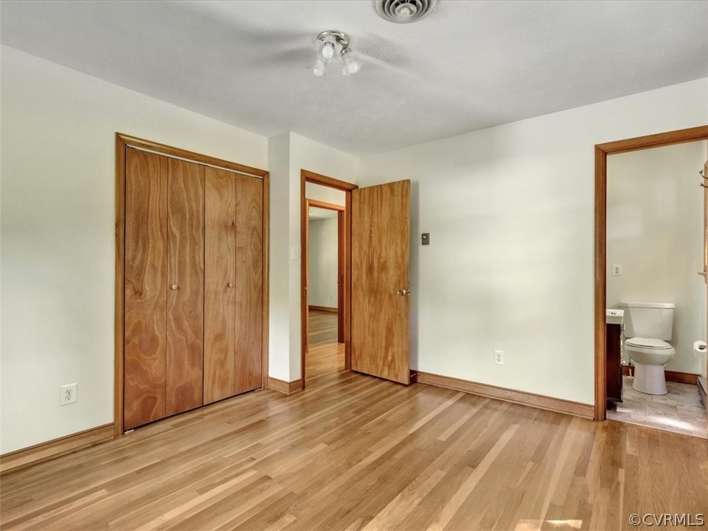 8801 Belmont Road Chesterfield, VA 23832 - Photo 15 of 24 a view of a room with wooden floor and bathroom