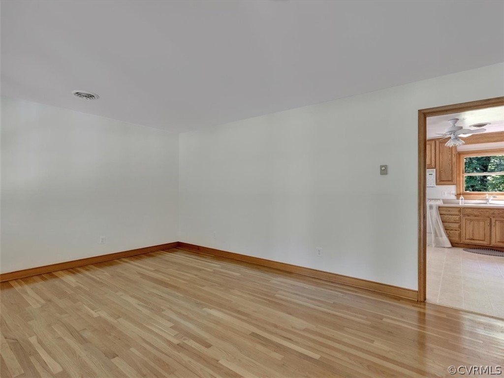 8801 Belmont Road Chesterfield, VA 23832 - Photo 5 of 24 a view of a room with wooden floor and a sink