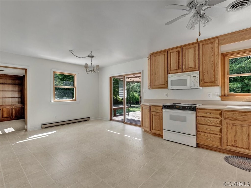 8801 Belmont Road Chesterfield, VA 23832 - Photo 6 of 24 a kitchen with stainless steel appliances granite countertop a stove a sink and a refrigerator