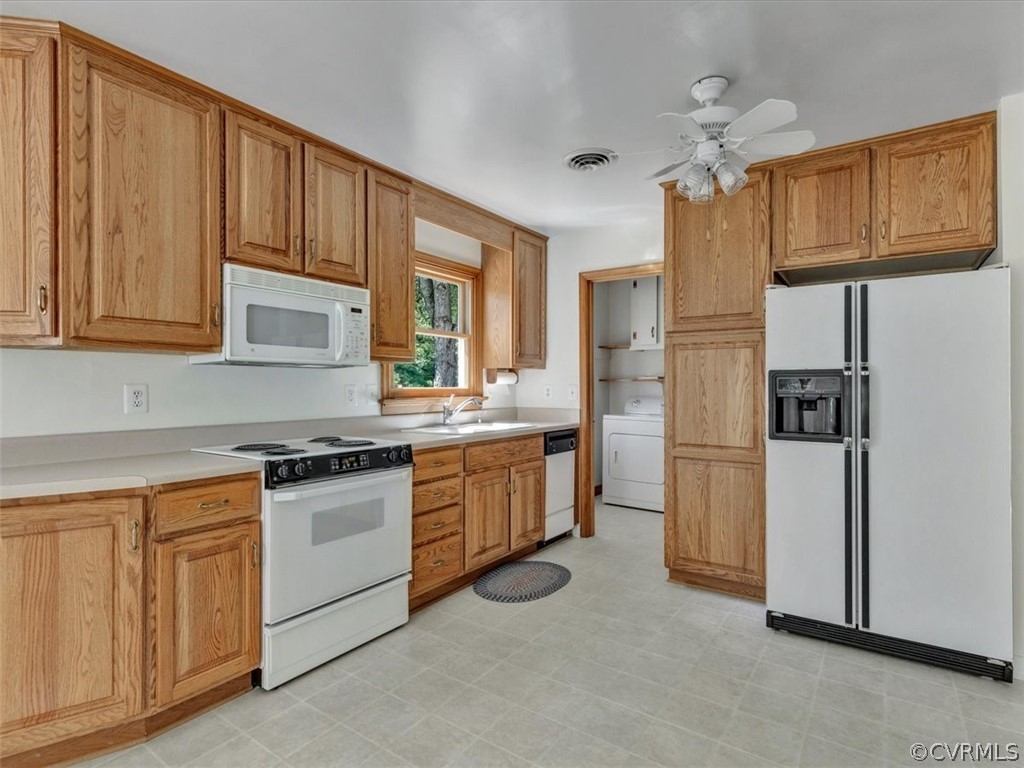 8801 Belmont Road Chesterfield, VA 23832 - Photo 8 of 24 a kitchen with white cabinets and stainless steel appliances