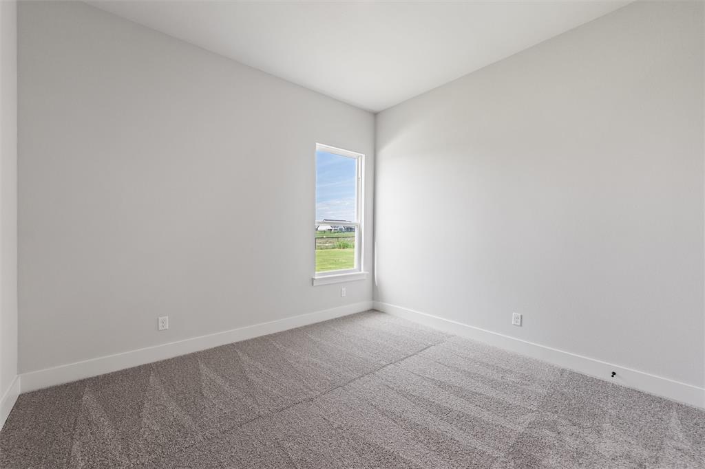 12108 Crystal Drive Krum, TX 76249 - Photo 20 of 40 an empty room with windows