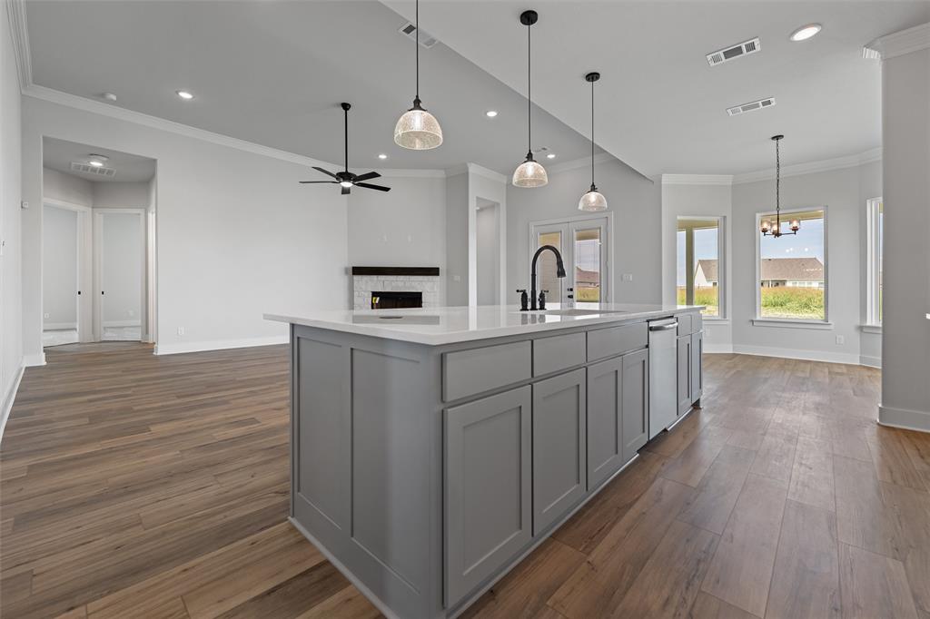 12108 Crystal Drive Krum, TX 76249 - Photo 30 of 40 a view of a kitchen counter space with wooden floor