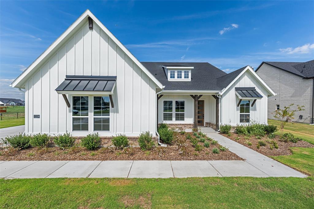 12108 Crystal Drive Krum, TX 76249 - Photo 3 of 40 a front view of a house with a yard