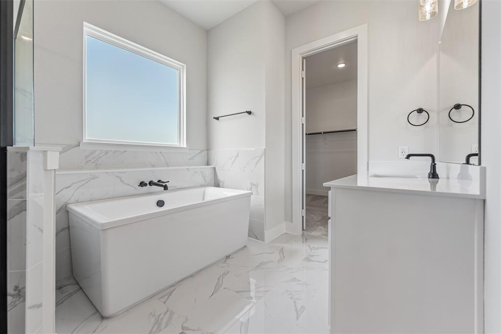 12108 Crystal Drive Krum, TX 76249 - Photo 36 of 40 a bathroom with a bathtub and a sink