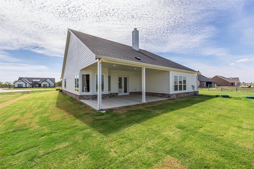 12108 Crystal Drive Krum, TX 76249 - Photo 39 of 40 a view of a house with a swimming pool and a yard