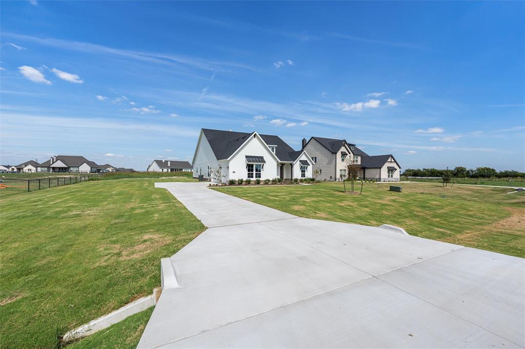 12108 Crystal Drive Krum, TX 76249 - Photo 7 of 40 a view of a house with yard and ocean view