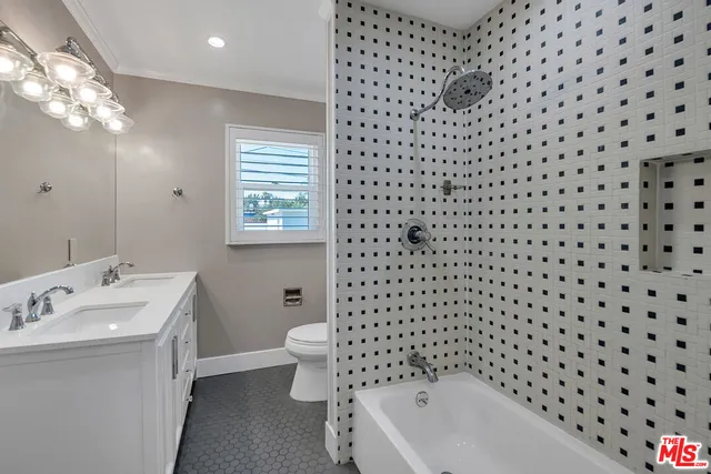 a bathroom with a sink a toilet and a bathtub