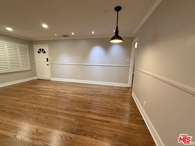 a view of a livingroom with wooden floor