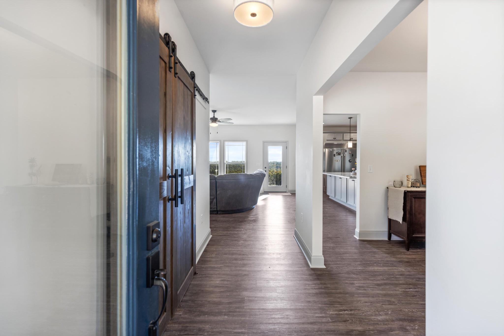 610 Summer City Firetower Road Pikeville, TN 37367 - Photo 16 of 60 a view of a hallway with wooden floor and a living room
