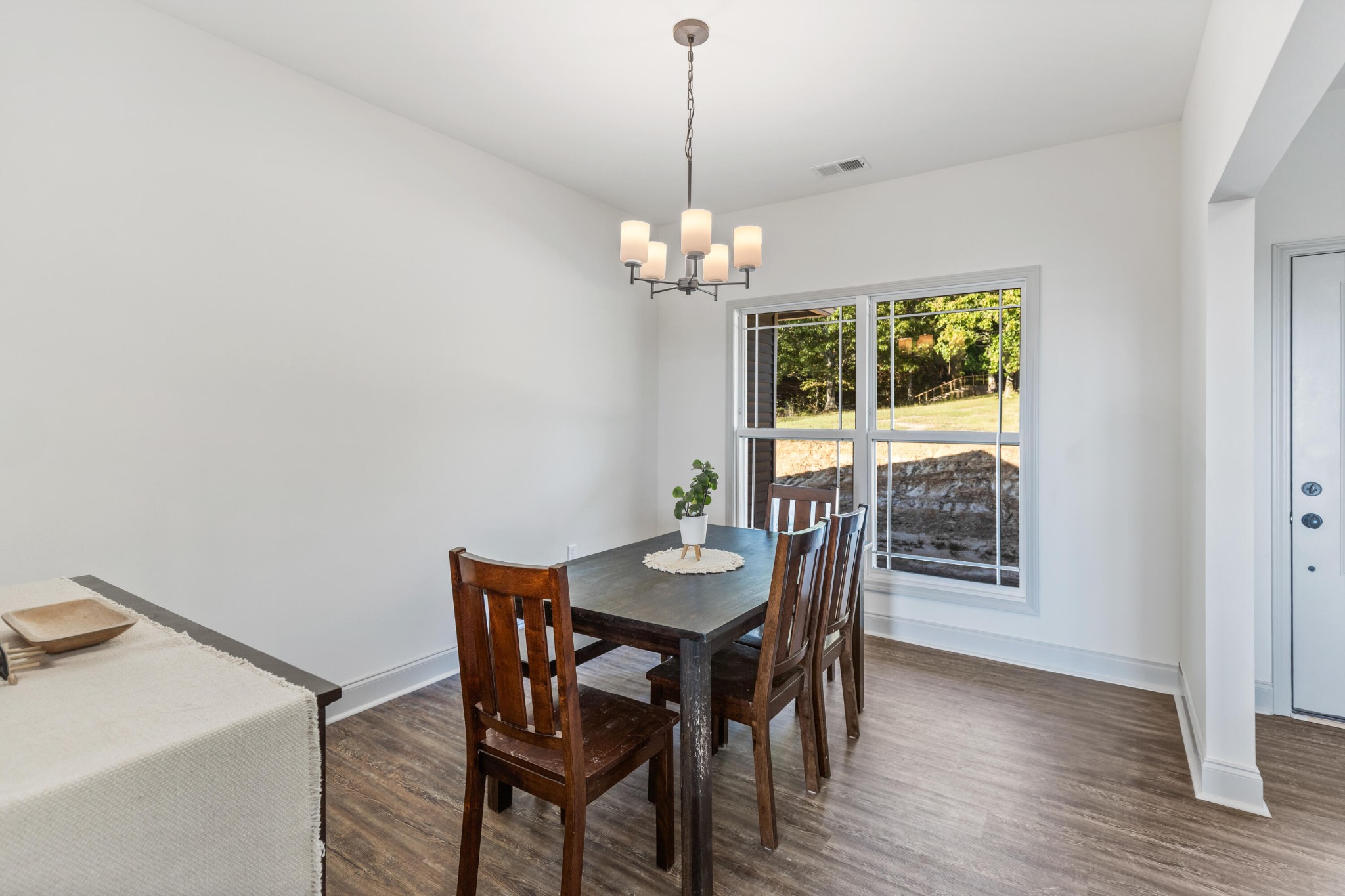 610 Summer City Firetower Road Pikeville, TN 37367 - Photo 20 of 60 a dining room with furniture a chandelier and wooden floor