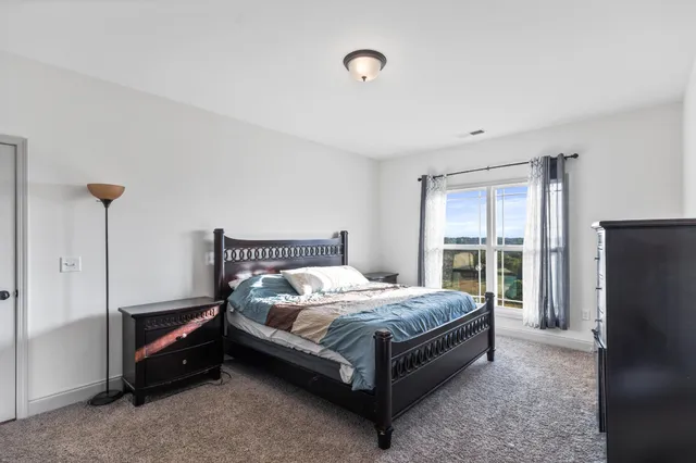 a bathroom with a granite countertop sink a bathtub and shower