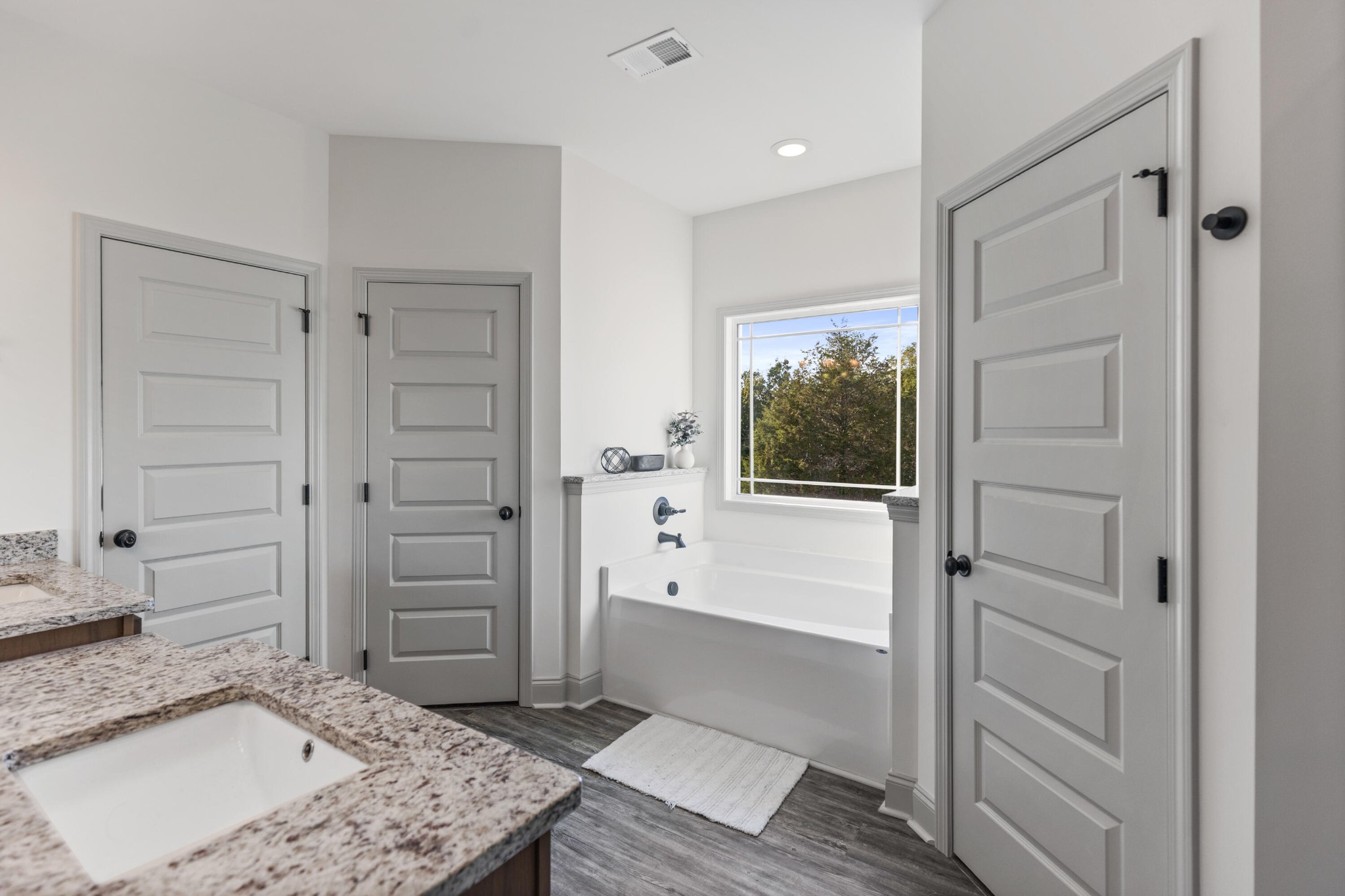 610 Summer City Firetower Road Pikeville, TN 37367 - Photo 26 of 60 a bathroom with a granite countertop sink a bathtub and shower