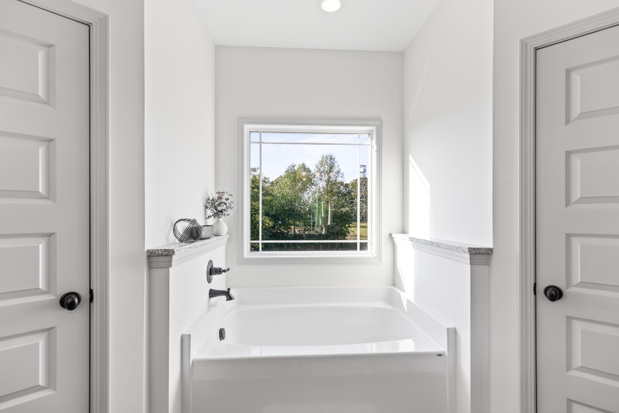 610 Summer City Firetower Road Pikeville, TN 37367 - Photo 28 of 60 a white bath tub sitting next to a window