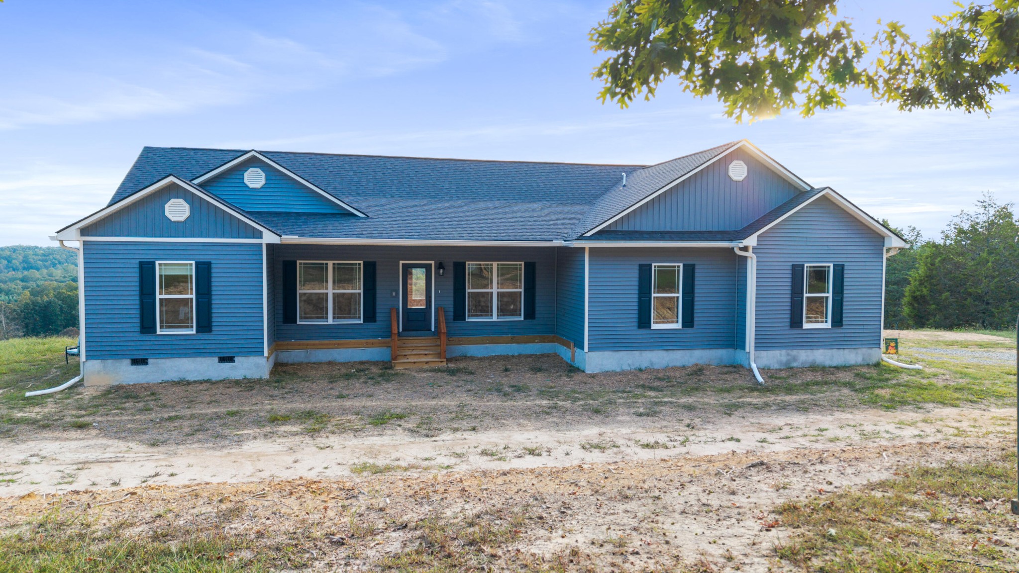 610 Summer City Firetower Road Pikeville, TN 37367 - Photo 3 of 60 a front view of a house with a garden
